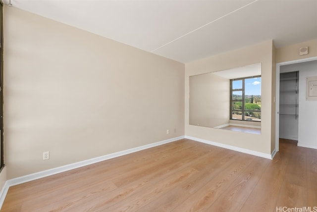 unfurnished room featuring light wood-type flooring