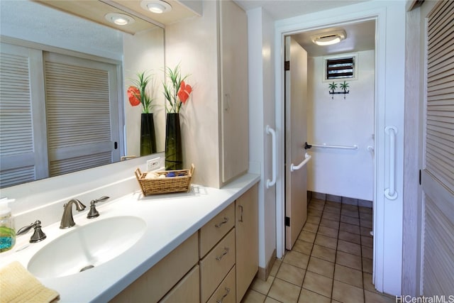 bathroom with vanity and tile patterned flooring