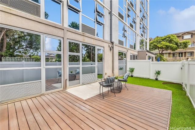 wooden deck with a yard