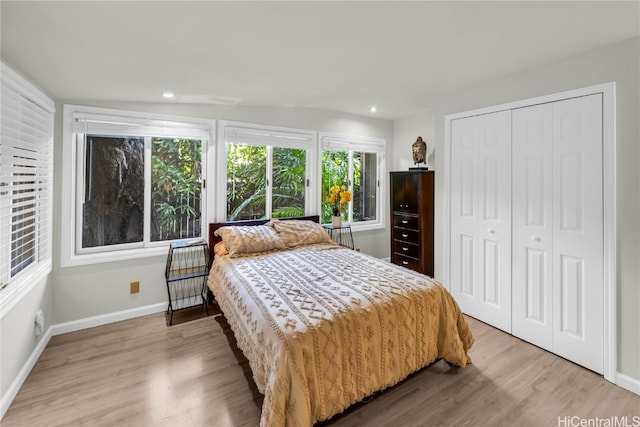 bedroom featuring light hardwood / wood-style flooring and a closet