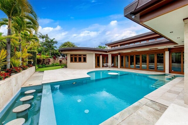 view of pool featuring a patio