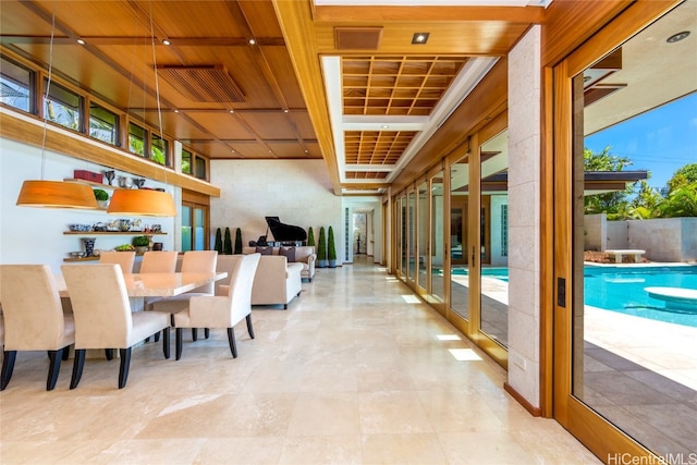 dining area featuring wood ceiling