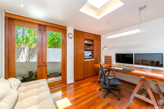 office space featuring light wood-type flooring and french doors