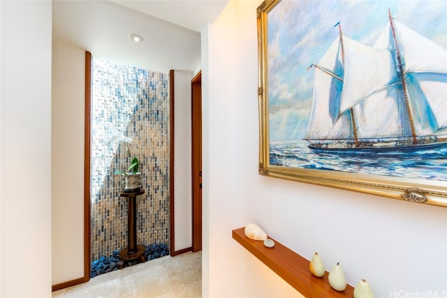 hallway featuring light tile patterned floors