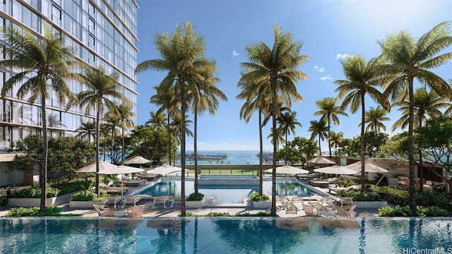 view of swimming pool featuring a patio area and a water view