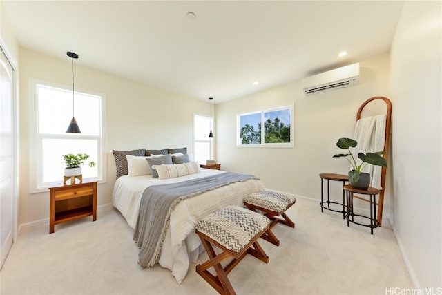 carpeted bedroom with an AC wall unit