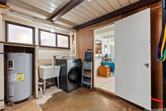 laundry area with electric water heater and washer / clothes dryer