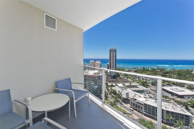 balcony featuring a water view