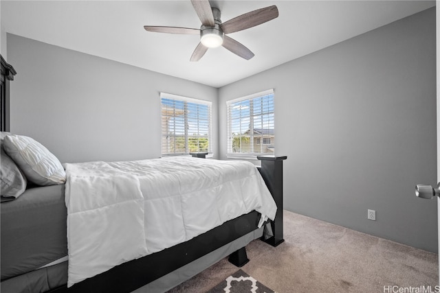 bedroom with ceiling fan and carpet flooring