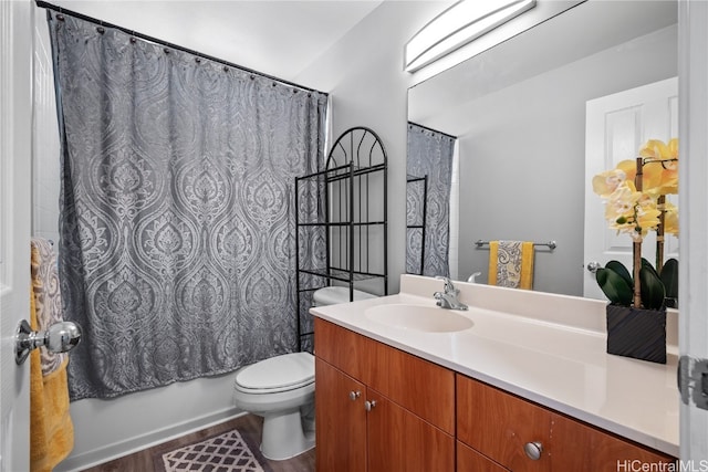 full bathroom featuring hardwood / wood-style floors, vanity, toilet, and shower / bath combination with curtain