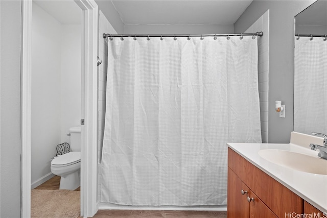 bathroom featuring vanity and toilet