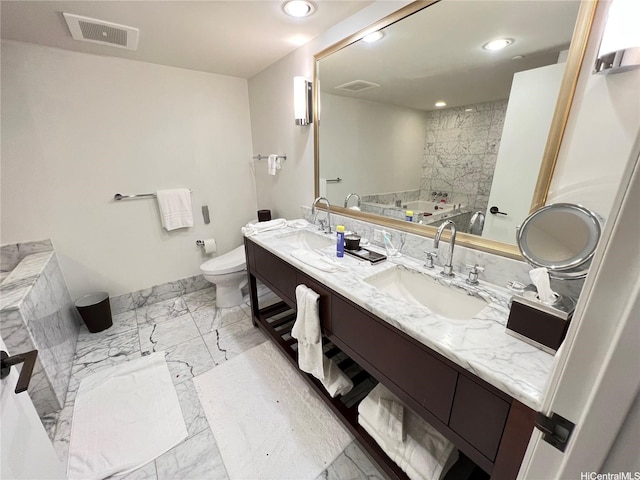 223 Saratoga Rd Unit 1108, Honolulu, HI 96815 - bathroom with marble look tiles, toilet, double vanity, recessed lighting, and a tub to relax in