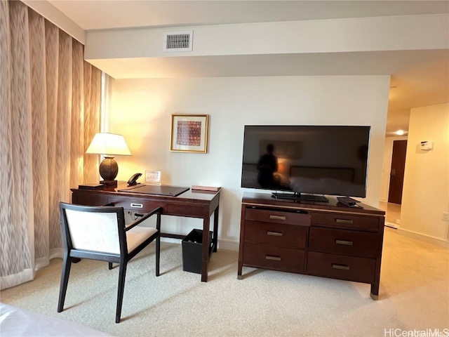 carpeted home office with wood walls