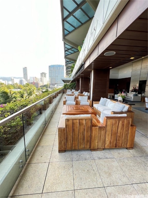 view of patio / terrace featuring an outdoor living space and a balcony