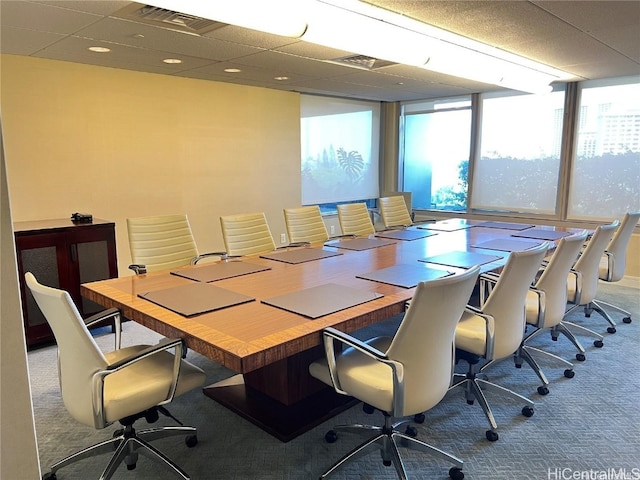 home office featuring carpet floors and a wall of windows