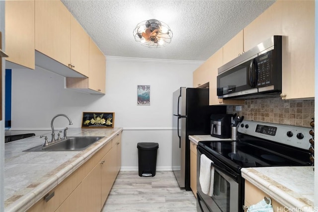 kitchen featuring stainless steel appliances, light brown cabinets, decorative backsplash, ornamental molding, and sink