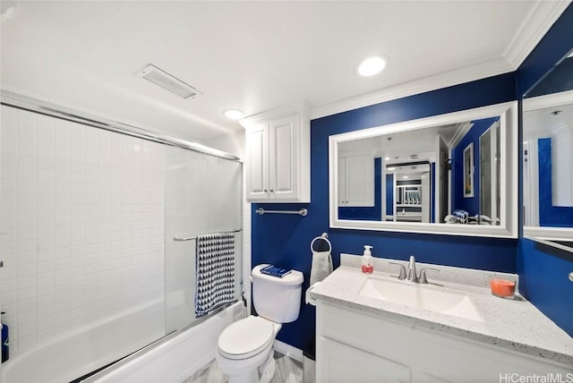 full bathroom featuring toilet, vanity, enclosed tub / shower combo, and ornamental molding