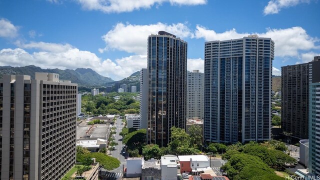 property's view of city featuring a mountain view