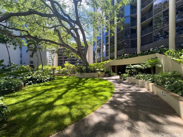 view of home's community with a yard