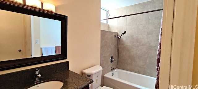 full bathroom featuring toilet, shower / tub combo with curtain, and vanity