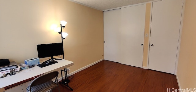 office with a textured ceiling and dark hardwood / wood-style flooring