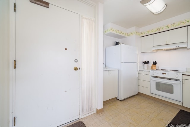 kitchen with white cabinets and white appliances