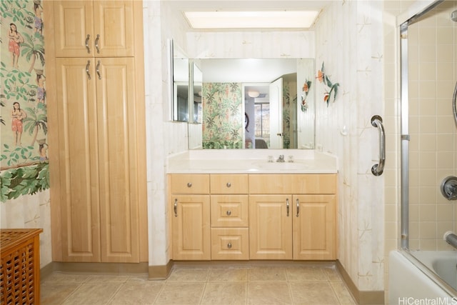 bathroom with vanity, combined bath / shower with glass door, and tile patterned flooring