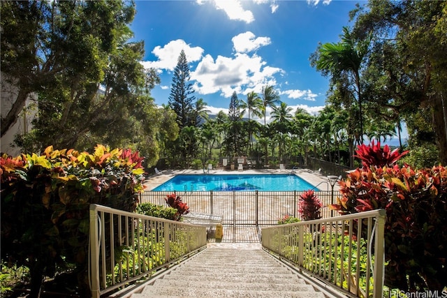 view of swimming pool featuring a patio area