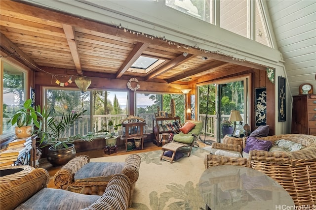 sunroom / solarium with vaulted ceiling with skylight, wood ceiling, and plenty of natural light