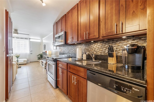 425 Ena Rd Unit 1202A, Honolulu, HI 96815 - kitchen with a sink, decorative backsplash, appliances with stainless steel finishes, and dark stone counters