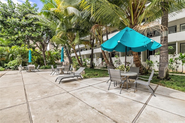 425 Ena Rd Unit 1202A, Honolulu, HI 96815 - view of patio featuring stairway and outdoor dining space