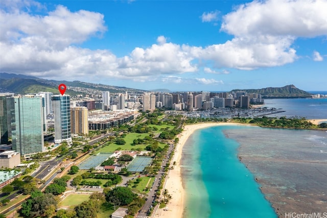 bird's eye view featuring a water and mountain view and a beach view