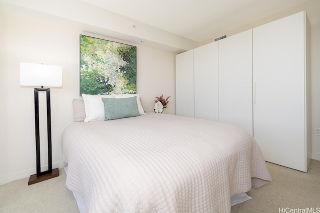 bedroom with light carpet