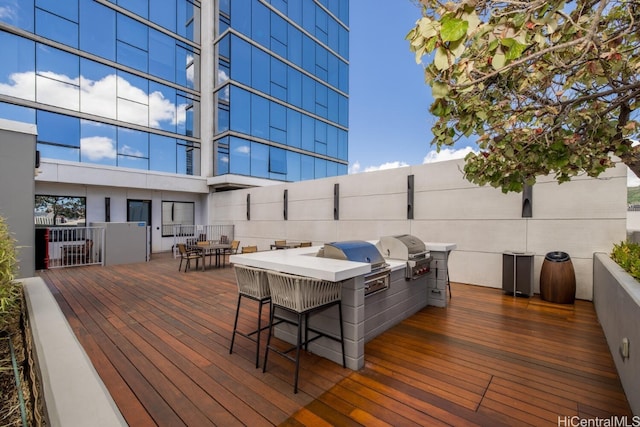 wooden deck with area for grilling and grilling area