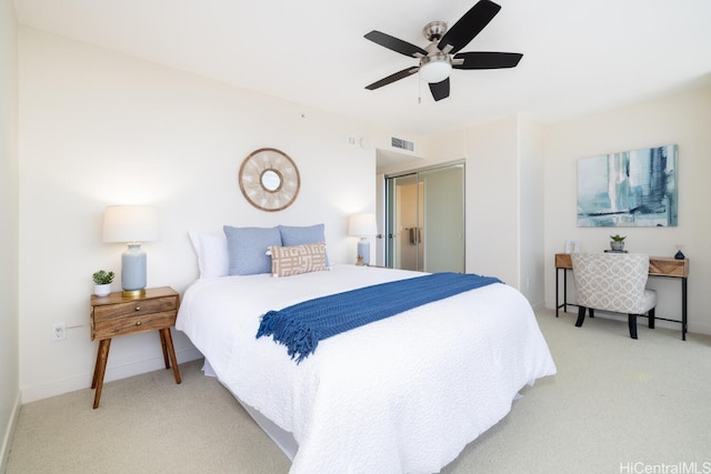 carpeted bedroom with ceiling fan