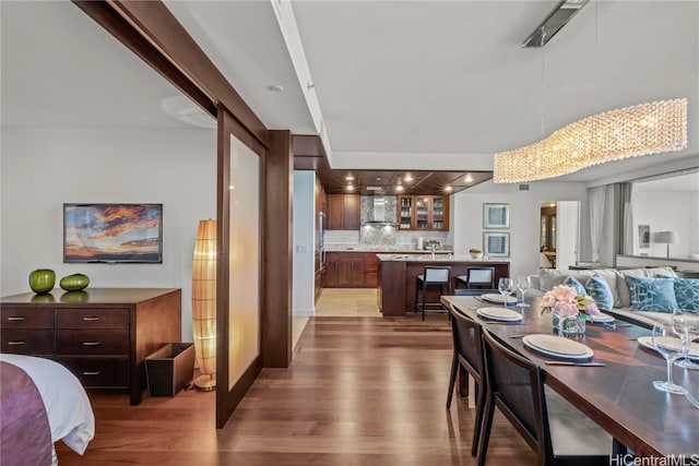 dining room with dark hardwood / wood-style flooring