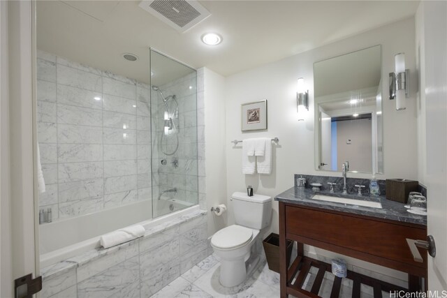 full bathroom featuring vanity, toilet, and tiled shower / bath