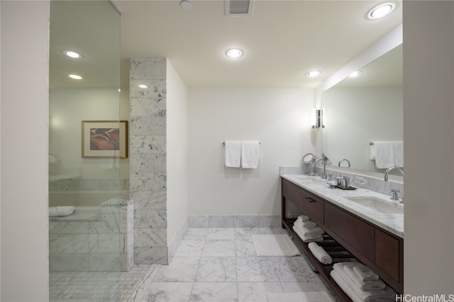 bathroom with vanity and a shower