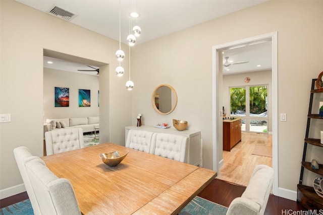 dining space featuring ceiling fan and light wood-type flooring