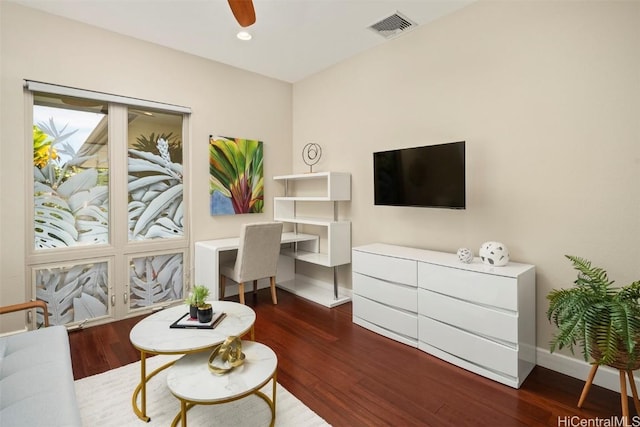 interior space with ceiling fan and dark hardwood / wood-style flooring