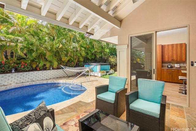 view of pool featuring a hot tub