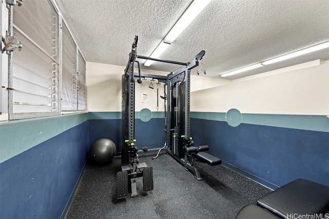 exercise area with a textured ceiling