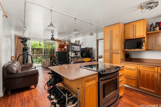 kitchen with ceiling fan, stainless steel electric range, pendant lighting, track lighting, and dark hardwood / wood-style floors