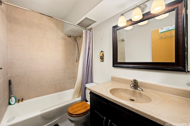 full bathroom featuring shower / bath combination with curtain, toilet, and vanity