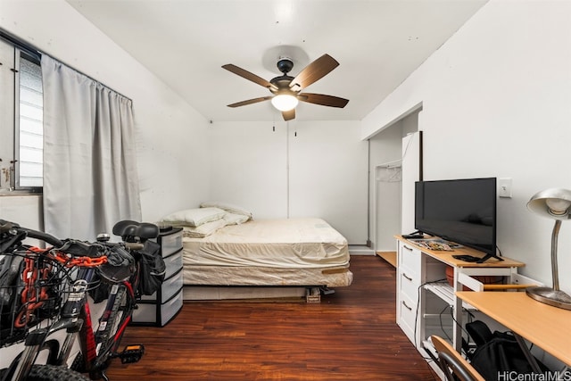 bedroom with dark wood-type flooring and ceiling fan