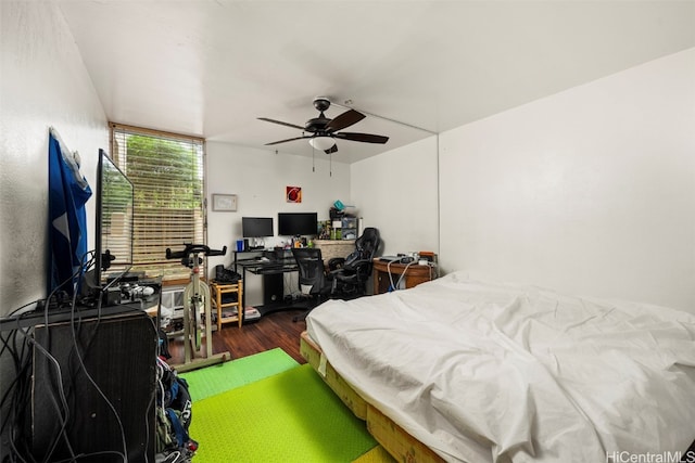 bedroom featuring dark wood-type flooring and ceiling fan