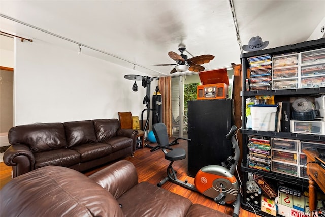 living room with hardwood / wood-style floors and ceiling fan