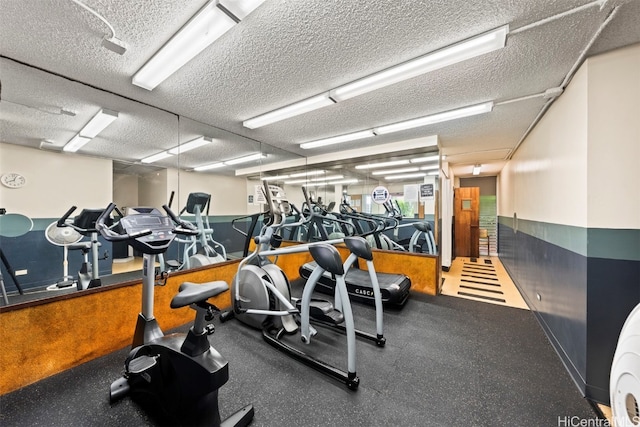 exercise room featuring a textured ceiling