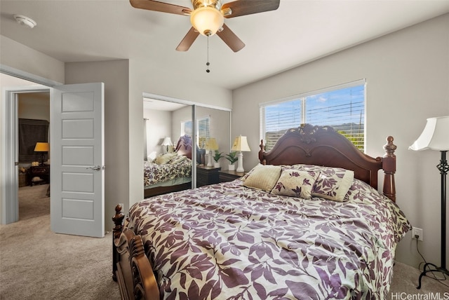 carpeted bedroom with a closet and ceiling fan