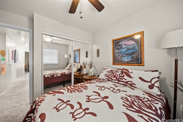 bedroom featuring a closet, ceiling fan, and light carpet